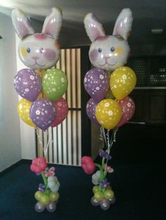 two bunny ears are on top of balloons in the shape of bunnies and rabbits