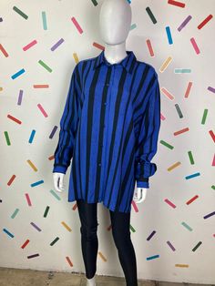 Colour: Blue / black Style: 80s shirt  Brand: No branding  Measurements: Bust: up to 50" Waist: 50" Hip: 50" Length: 31" Material: 100% Viscose Condition: This is in great vintage condition. Other: This is a fabulous 80s long sleeve shirt with an oversized cut. Retro Blue Shirt For Fall, Vertical Stripes Long Sleeve Shirt For Fall, Long Sleeve Shirt With Vertical Stripes For Fall, Black Shirt With Vertical Stripes For Spring, Fall Long Sleeve Shirt With Vertical Stripes, Oversized Long Sleeve Retro Shirt, Retro Black Long Sleeve Shirt, Oversized Retro Blue Shirt, Oversized Long Sleeve Shirt With Striped Collar