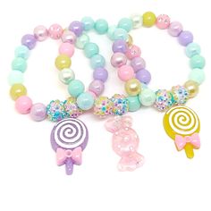 These adorable bracelets are the perfect favor for your little one's candy themed party! Each bracelet features a bright rainbow swirl clay lollipop charm, resin rhinestone beads and an assortment of bright rainbow 10mm acrylic beads strung with durable stretch cord. Each bracelet will arrive individually packaged in organza bags. Please select the number of bracelets and bracelet size needed from the drop down menu. Please message me if you have any questions. To be the first to know about new Pastel Resin, Rainbow Lollipop, Lollipop Birthday, Candy Themed Party, Rainbow Lollipops, Candy Birthday, Candy Bracelet, Pastel Candy, Fake Jewelry