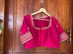 Hand embroidered ready made saree blouse / crop top/stitched saree blouse usa / pink saree blouse/modern blouse/zardosi blouse/red elbow sleeve saree blouse/ pure silk blouse/ maggam work blouse        It is very true that a perfect blouse is the one which makes your saree look stand out !! If you find one of such a style that you have been wanting to have then dont let it go !! we carry such unique trending blouses that instantly add a stylish look to any saree !!     Well..!! we understand that you may not get in your desired size/pattern, here you go with customization according to your size/pattern which we can deliver in 1-2 weeks of time period !!      Here is a beautiful Hand embroidered zardosi work crop top / blouse in pink color that has U neck design emblished with gold hand emb Traditional Fitted Pink Blouse Piece, Traditional Pink Unstitched Blouse Piece, Pink Art Silk Blouse Piece With Dori Work, Traditional Pink Tops With Dori Work, Traditional Pink Top With Dori Work, Pink Blouse Piece With Resham Embroidery, Pink Dola Silk Traditional Wear With Handwork, Bollywood Style Pink Tops With Dori Work, Silk Blouse Piece With Pink Dori Work