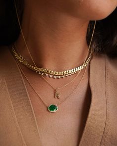 14k solid gold, pave diamond, and a beautifully handpicked free form emerald, available in yellow, white and rose gold, hanging from a 16''-18'' adjustable chain. Timeless and perfectly handcrafted, wear it up or down, by itself or layered. Size of Emerald: Approx. 13mm(W) by 11mm(H) Diamond Carat Weight: Approx. 0.08 ctw Diamond Quality: VS Total Weight: Approx. 2 grams Due to the nature of this item all stones may vary in color and inclusions making each piece a one of a kind Standard Producti 14k Gold Green Necklace With Diamond Accents, Green 14k Gold Necklace With Diamond Accents, Gold Emerald Necklace With Adjustable Chain, Green 14k Gold Necklace With Adjustable Chain, Fine Jewelry Diamond Necklace With Curb Chain As Gift, Gold Emerald Necklace With Diamond Accents, Gold Emerald Necklace With Diamond Accents For May Birthstone, Emerald Mangalsutra, Emerald Necklace Gold