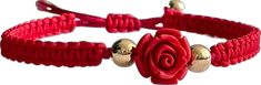 a red bracelet with a rose on it