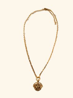 The Roman Coin Necklace combines a delicate gold link 18 kt. Gold plated chain and a detailed Roman coin pendant, exuding sophistication and historical charm. Each intricate link in the chain complements the intricacies of the coin, creating a timeless and refined accessory perfect for any occasion. 18 Inches in length +2 inch extender Complete your look with The G Necklace. Gold-tone Medallion Necklace With Coin Pendant, Gold-tone Pendant Medallion Necklace, Gold Plated Coin Pendant Necklace, Yellow Gold Medallion Coin Necklace With Adjustable Chain, Gold-plated Medallion Necklace With Round Pendant, Gold-plated Round Medallion Necklace With Gold Chain, Gold Chain Medallion Necklace, Gold Chain Medallion Necklace As Gift, Gold Plated Medallion Necklace With Round Pendant