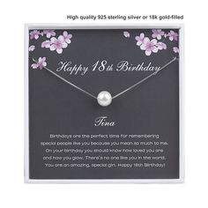 a birthday card with a pearl necklace in the middle and flowers on it's back