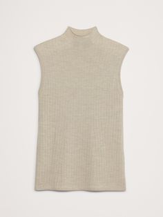 A classic ribbed sweater tank, knitted from our signature extra-fine Merino wool using a ribbed-knit stitch to enhance its cut.  Plus, we added a bit of extra length at the hem with side slits for easy layering.  Semi-fitted.  Responsible Wool Standard Certified: This global standard protects the sheep that supply the wool for this garment as well as the land they graze, working to make it better for the environment and the sheep.  Mock neck.  Straight hem with side vent detail.  Semi-fitted.  S Ribbed Cashmere Tops, Solid Color Ribbed Cashmere Tops, Ribbed Beige Workwear Tops, Ribbed Beige Tops For Workwear, Beige Ribbed Tops For Workwear, Beige Ribbed Tops For Work, Ribbed Cashmere Turtleneck Top, Fitted Beige Ribbed Sweater Vest, Elegant Ribbed Tank Top For Fall