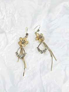 🌟The seller will be away from December 23, 2024, to February 1, 2025. Any orders placed during this period will be shipped after February 1, 2025. Thank you for your understanding! ✧ Perfect as a gift for loved ones or a stunning addition to your jewelry collection, the Elegant Long Floral Tassel Earrings are a versatile accessory that brings beauty and grace to any occasion. Embrace the blend of delicate florals and flowing tassels, and let these earrings become your go-to choice for a touch o Flower Charm Earrings For Mother's Day Anniversary, Flower Charm Earrings For Anniversary On Mother's Day, Flower Charm Earrings For Anniversary And Mother's Day, Elegant Gold Earrings For Mother's Day, Party Flower Charm Dangle Earrings, Dangle Earrings With Flower Charm For Party, Party Jewelry With Flower Charm Drop Earrings, Party Dangle Earrings With Flower Charm, Mother's Day Dangle Earrings With Flower Charm