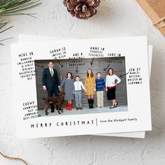 a family christmas card with the words merry christmas on it and a pine cone next to it