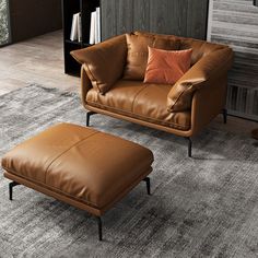 a brown leather chair and ottoman in a living room