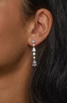 Complete your look with the sparkling glamour of these linear drop earrings set with faceted stones. 1 5/8" drop; 1/4" width Post back Rhodium or 18k-gold plate/cubic zirconia Imported Formal Silver Jewelry, Long Drop Linear Earrings With Diamond Accents, Classic Cubic Zirconia Long Drop Linear Earrings, Classic Drop Linear Earrings With Diamond Accents, Classic Linear Earrings With Diamond Accents, Classic Long Drop Linear Earrings With Diamond Accents, Long Drop Linear Earrings With Diamond Accents For Anniversary, Anniversary Diamond Accented Long Drop Linear Earrings, Long Drop Cubic Zirconia Linear Earrings