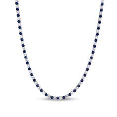 This luxe blue lab-created sapphire and diamond tennis necklace is bursting with color and sparkle. 10K white gold Diamonds, the largest being 1/8 ct. each, alternate with blue lab-created sapphires in a continuous line 8 cts. t.w. of diamonds 16.5-inch necklace; box clasp Anniversary Gemstone Tennis Necklace, Anniversary Round Gemstone Tennis Necklace, Anniversary White Gold Gemstone Tennis Necklace, Silver Necklace With Prong-set Lab-created Sapphire, Round Gemstone Tennis Necklace Fine Jewelry, Silver Necklace With Lab-created Sapphire In Prong Setting, Round Lab-created Sapphire Necklace With Diamond Cut, Fine Jewelry Necklace With Brilliant Cut Lab-created Sapphire, Round Diamond Cut Necklace With Lab-created Sapphire