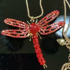 Betsey Johnson Necklace Dragon Fly Red Rhinestones 15" Chain Dragon Fly Is 3" Long Gold Tone New Old Stock Red Rhinestone Necklace For Party, Red Rhinestone Party Necklaces, Red Metal Necklaces For Party, Red Metal Jewelry With Rhinestones, Red Rhinestone Necklace For Gift, Red Jeweled Crystal Necklace, Red Rhinestone Necklaces For Gifts, Red Jeweled Rhinestone Necklace For Party, Necklace Dragon