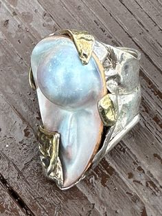 Mother of Pearl Sterling Silver with Gold swatches.  This ring was cast one of a kind in waxing design.   The size is 7 3/4. Lavender Stone, Pearl Rings Vintage, Cast Rings, Raw Stone Jewelry, Sterling Silver Filigree, Rare Gemstones, Silver Filigree, Raw Stone, Silver Pearls