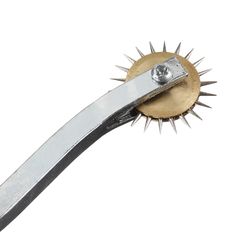 a close up of a metal object with spikes on it's end and a white background