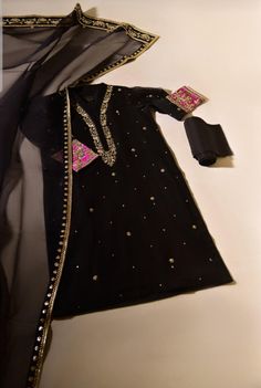 This beautiful three piece is rendered on luxurious pure fabrics with delicate zardosi hand craftsmanship in antique+gold. The dupatta is adorned with hand gotah, oh so pretty. The handwork on this single outfit takes upto 1200 hours. ﻿Delivery Time: ﻿4 to 6 weeks Fancy Dresses Black, Heavy Dupatta, Agha Noor, Pakistani Formal Dresses, Indian Bride Outfits, Velvet Dress Designs, Pakistani Wedding Outfits, Pakistani Fashion Party Wear, Salwar Kamiz