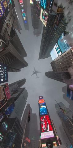 an aerial view of a city with skyscrapers and billboards in new york's times square