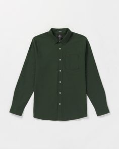 Crafted from soft, breathable 100% cotton, this button-down Oxford shirt delivers a timeless style with a left chest pocket and a button-down collar detail. Comfortable and versatile, it's a wardrobe essential you'll reach for over and over again. Featured here in green. - 
 - 100% Cotton oxford
 - Classic fit
 - Left chest pocket
 - Novelty logo buttons
 - Two color Volcom word embroidery at chest pocket Word Embroidery, Snow Surfing, Dark Forest, Oxford Shirt, Button Down Collar, Timeless Style, Chest Pocket, Long Sleeve Shirt, Wardrobe Essentials