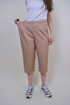 "90s beige chino capris, vintage women straight long shorts, Size W 34 Welcome to TARASCOMMON.ETSY.COM Unique clothing from the 20th century. Model tall 170cm. Size: FR/B - 44; Eur - 42; UK 16; Width - 39-49cm / 15.35-19.29inch; Length - 80cm / 31.49inch. All measurements are taken seam to seam while lying flat. Cotton. Polyester. This item is vintage, so it can have some defects. Additional photos can be send We are glad that you are interested in lots that we sell. Wish you a good shopping! FO Beige Knee-length Workwear Shorts, Beige Knee-length Shorts For Work, Classic Beige Knee-length Shorts, Classic Beige Bermuda Shorts With Pockets, Khaki Knee-length Spring Bottoms, Spring Khaki Knee-length Bottoms, Classic Beige Knee-length Bottoms, Casual Beige Knee-length Pants, Beige Cotton Ankle-length Capris