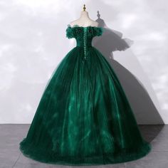 Embrace a vision of enchantment with our Gothic Emerald Green Tulle Wedding Dress, featuring a stunning Layered Ruffle Neckline. This dress epitomizes bridal beauty with its opulent tulle construction that creates a dramatic, full-bodied silhouette. The lush layers of ruffles at the neckline provide a soft, romantic fr Gunne Sax Wedding Dress, Victorian Style Wedding Dress, Antique Wedding Dresses, Victorian Style Wedding, Green Ball Gown, Dress Banquet, Nontraditional Wedding Dress, Antoinette Dress, Off Shoulder Evening Dress