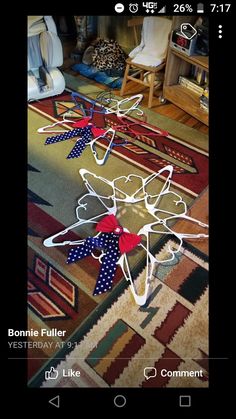 a bunch of bows that are on the ground in front of a chair and rug