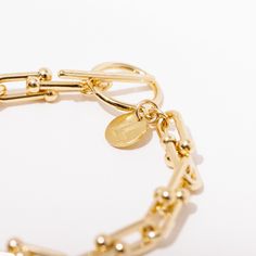 We can't wait to see you shining in this bracelet - because when one of us shines, all of us shine! This babe features shiny gold plated brass chain in a unique cable style. It is 7.5 inches in length and closes with a toggle clasp. This item is shipped directly from the maker! This means you may receive your order in multiple shipments (if you are ordering more than one item) and if it is being made-to-order, please be mindful of the designer's individually allocated lead times! We are proudly Moira Rose, Catherine O'hara, Schitt's Creek, Schitts Creek, Toggle Clasp, Brass Chain, All Of Us, Boss Babe, See You