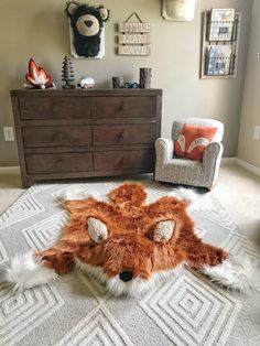 an animal rug is on the floor in a child's room with two chairs and a dresser