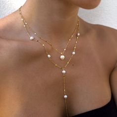 "Our gorgeous freshwater pearl necklaces make the perfect bride, bridesmaid, friend, family gifts. Delicately and carefully handmade with the most excellent and sparkling chain. The dainty minimalist chain dazzles along with our freshwater pearls.  We have the single pearl necklaces or long lariat-style necklace. Each are sold separately.  Wedding/Bridesmaids Discounts:  We offer discounts for multiple pieces, just send us over a message and we will gladly help! We can also put together a gorgeous gift box for your loved ones.  Single Pearl Necklace Length: 16 inches with extra 2\" chain extender Material: Stainless Steel Finish: 18K Gold Plating / Platinum Plating -  PROCESSING TIME -  This piece is handmade to order and is ready to ship in 1-2 business days.  - ABOUT MINKKSI -  https://w Boho Bride Necklace, Pearl Chain Necklaces For Wedding, Elegant Wedding Pearl Necklace With Clavicle Chain, Elegant Wedding Clavicle Pearl Necklace, Elegant Lariat Jewelry For Wedding, White Lariat Necklace With Pearl Charm As Gift, Elegant Pearl Charm Necklace For Wedding, White Pearl Charm Lariat Necklace Gift, Akoya Pearl Clavicle Chain Necklace For Wedding