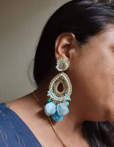 "Bohemian handmade statement turquoise blue embellished large earrings. These beautiful turquoise earrings are hand crafted beautifully using various material like fabric, glass, chatton,pompoms etc. An ideal summer party earrings The rarrings measure about approx. 3.80\" long and 2.20\" wide. Each beautiful Carnation jewellery piece is handcrafted in India and ship from India. Please note, Since our product is purely handmade in nature hence a slight imperfection may be there. But I try and mak Bohemian Blue Earrings For Party, Blue Handmade Danglers For Festive Occasions, Traditional Handmade Blue Danglers, Handmade Blue Danglers For Wedding, Bohemian Beaded Flower Earrings For Wedding, Turquoise Earrings For Wedding And Festivals, Bohemian Blue Teardrop Flower Earrings, Blue Bohemian Teardrop Flower Earrings, Blue Teardrop Bohemian Flower Earrings