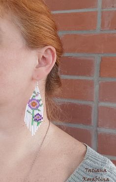 These handmade unique earrings with abstract floral print are made of high-quality Czech beads and strong synthetic thread. I use my author's scheme . They are elegant, fashionable, and highly versatile, suitable for everyday wear. Color: white,pink,purple,red,orange, green . 100% hand made with love! I beg you not to copy my authoring Copy without my permission is prohibited For those who want to buy my copyright scheme for these earrings: https://www.etsy.com/uk/listing/974991392/brick-stitch- White Dangle Flower Earrings With Colorful Beads, White Flower Dangle Earrings With Colorful Beads, Elegant White Chandelier Earrings With Colorful Beads, White Beaded Earrings With Colorful Beads, Colorful Beaded White Chandelier Earrings, White Dangle Beaded Earrings, White Dangle Flower Earrings With Beads, White Flower Drop Earrings For Summer, White Beaded Earrings For Summer Gift