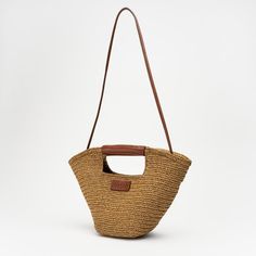 100% Handmade 100% Paper String 100% Leather Made in Turkey Size:  Height : 27 cm Width: 42 cm Depth: 15 cm Handle Height: 17 cm Luxury Tan Bucket Bag With Handles, Luxury Straw Tote Bag, Luxury Handheld Bucket Bag For Travel, Luxury Handheld Bucket Bag For Everyday, Luxury Leather Satchel For Summer, Leather Beach Bag For Everyday Use, Luxury Brown Bucket Bag With Top Carry Handle, Luxury Tan Bucket Bag For Everyday Use, Luxury Summer Satchel