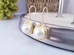 Check out this item in my Etsy shop https://www.etsy.com/listing/536220546/pearls-beige-earrings-pearls-earrings Elegant Dangle Pearl Earrings For Mother's Day, Elegant Adjustable Earrings For Mother's Day, Elegant White Earrings For Mother's Day, Round Bridal Earrings With Ear Wire, Dainty Nickel-free Pearl Earrings For Wedding, Pearl White Dangle Bridal Earrings As A Gift, Hypoallergenic Wedding Jewelry For Mother's Day, Hypoallergenic Jewelry For Wedding On Mother's Day, Elegant Hypoallergenic Earrings For Mother's Day