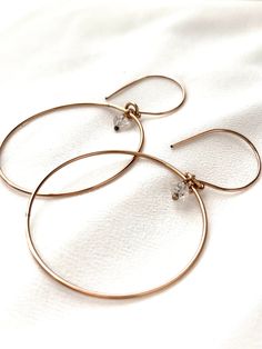 Just as effortless as they are simple, these hoop earrings are an essential everyday piece. Item Details: • This listing is for A PAIR ( 2 pieces ) earrings.• All metal is components are sterling silver and 14k gold-fill• Hoops measure 40mm in diameter.• Herkimer quartz crystals prized, each Herkimer diamond is a natural entity and no stone is identical.• The order will arrive in a gift-wrapped box and free polishing cloth. It will be ready for gift giving. All our work is custom-made by hand in Hypoallergenic Small Hoop Earrings In 14k Gold Filled, Simple Design 14k Gold Earrings, Everyday Hoop Jewelry In Recycled Gold, Classic Everyday Hoop Earrings In Recycled Gold, Everyday Recycled Gold Hoop Jewelry, Nickel-free Small Hoop Earrings In 14k Gold Filled, Everyday Round Huggie Earrings In Recycled Gold, Minimalist Everyday Hoop Jewelry, Dainty Hoop Jewelry For Everyday