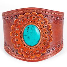 Western style hand-tooled vegetable tanned cowhide leather cuff bracelet is hand made by American Darling.A unique design pattern that catches the eye with its undeniable charm.The handmade leather bracelet is a go-to for your western look with any outfit you choose to slay in.2 snap button closure options to fit your wrist accordingly. Rustic Hand Tooled Leather Jewelry, Leather Concho Cuff Bracelet, Western Style Brown Cuff Bracelet As Gift, Leather Cuff Bracelet With Concho, Bohemian Leather Bracelet For Gift, Bohemian Leather Bracelet Gift, Unique Adjustable Hand-stitched Jewelry, Unique Hand-stitched Adjustable Jewelry, Western Style Leather Concho Bracelet As Gift