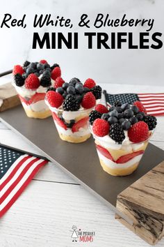 red, white and blueberry mini trifles on a tray