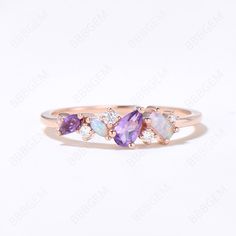 three stone ring with amethorate and white topaztes in 18k rose gold