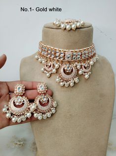 *Light Weight kundan choker necklace set. *Beautiful & Light in weight. *Necklace width: 1.5 inches (included drops) *Earrings length: 2.5 inches  (with drops)   *Earrings width- -1.5 inches White Kundan Sets For Celebrations, White Meenakari Party Sets, Festive White Choker Necklace, White Kundan Necklace With Stone Work For Party, White Hand Set Kundan Necklace For Party, White Kundan Festive Jewelry, White Kundan Jewelry With Meenakari, White Chandbali Kundan Necklace For Diwali, White Meenakari Temple Jewelry Choker