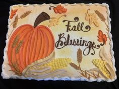 a cake decorated with an image of a pumpkin and corn on the cob that says fall blessing