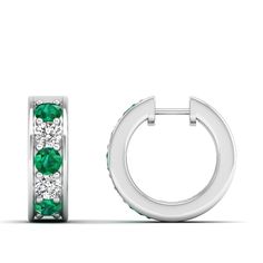 These exquisite emerald and diamond hoop earrings are a stunning addition to any jewelry collection. Crafted with precision and attention to detail, the vibrant emeralds are elegantly complemented by the sparkling diamonds, creating a luxurious and sophisticated look that is perfect for any occasion. Metal: 14K Gold Setting Type: Prong Rhodium Finish: Yes, on White Gold Gemstone Details: Gemstone: Emerald Shape: Round Average Dimensions: 3.00 MM Quantity: 06 Average Cut: Very Good Average Color: Luxury Emerald Earrings With Diamond Accents, Fine Jewelry Emerald Huggie Earrings, Elegant Round Hoop Earrings With Emerald, Classic Emerald Diamond Earrings Gia Certified, Classic Gia Certified Emerald Diamond Earrings, Formal Emerald Earrings With Diamond Accents, Fine Jewelry With Channel Set Green Stones, Gia Certified Green Diamond Earrings For Anniversary, Green Round Diamond Earrings Fine Jewelry