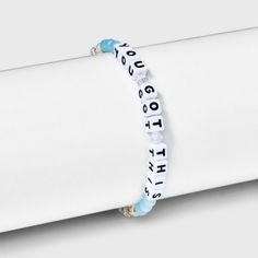 Forget the haters. You know you got this! Wear this beaded word bracelet from Little Words Project® as a reminder. Handcrafted with eye-catching aqua beads and irridescent crystals, this stretch-fit style sits comfortably on the wrist. Stack it with your favorite bracelets for a daily dose of self-love and kindness. This Little Word® is more than just a bracelet. It’s your key to inspiring a kinder world. Wear your word as long as you need it. When you’re ready, pass it on to someone else who ne Inspirational Blue Adjustable Beaded Bracelets, Blue Inspirational Adjustable Beaded Bracelets, Trendy Turquoise Stretch Bracelet With Letter Beads, Trendy Adjustable Stretch Bracelet With Letter Print, Fun Blue Beaded Bracelet With Letter Beads, Blue Letter Beads Bracelets For Beach, Cheap Ocean-inspired Beaded Bracelets As Gift, Blue Charm Bracelet With Letter Beads, Cheap Ocean-inspired Beaded Bracelet