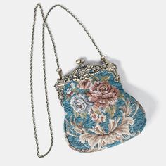 Introducing our captivating collection of Chatelaine purses, inspired by the elegance of the Victorian era.Available in three sizes—Large, Medium, and Small—these purses offer versatility and style. The Large and Medium sizes can be used as both a clutch and a crossbody purse, as we provide two chains for each size: 50" and 13" in length. This allows you to effortlessly switch between crossbody and clutch styles.Let's focus on the Chatelaine Large Crossbody Purse:With a frame width of 6.25" and a height of 8", this purse comfortably holds larger items like the iPhone 14 Pro Max and a passport. It features a small slip pocket for cards or small essentials, and the 1.5" bottom depth provides ample space for your necessities.The Large Crossbody Purse includes two chains, each with brass hooks Blue Handheld Bag With Gold-tone Hardware, Large Crossbody Purse, Blue Vintage Bag With Gold-tone Hardware, Luxury Vintage Evening Bag With Gold-tone Hardware, Ladies' Floral Embroidery Top Handle Bag, Blue Clutch Bag With Gold-tone Hardware, Brass Hook, Secret Sale, Chatelaine