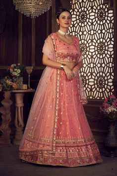 color-orange, fabric-net, work-embroidered, brand-name-krupali-savani,occasion-festivewear, occasion-wedding-guest, womenswear,ideal-for-women, lehengas, Product Features: Color: Orange Lehenga Fabric: Net Choli Fabric: Net Work: Embroidered Work Sleeves: Sleeveless Neck Type: Round Neck Wash Care: Dry Clean Occasion: Festivewear, Wedding Guest Product Type: Lehenga Choli with Dupatta Disclaimer: There will be slight difference in digital to actual image Orange Sharara For Wedding, Orange Dori Work Sharara, Net Lehenga For Reception, Semi-stitched Orange Sharara With Resham Embroidery, Net Anarkali Lehenga, Orange Traditional Wear With Resham Embroidery, Peach Traditional Wear With Intricate Embroidery For Wedding, Peach Traditional Wear With Resham Embroidery For Reception, Orange Semi-stitched Sharara With Dori Work