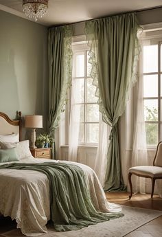 a bedroom with green walls and white curtains