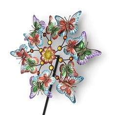 a multicolored clock with butterflies on it