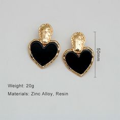 Discover Timeless Elegance Introducing our latest collection piece, the Black Heart Drop Earrings, a perfect blend of vintage charm and contemporary fashion. These earrings feature a classic heart shape, embodying love and elegance in every detail. Crafted from durable zinc alloy, they boast a glossy black finish that adds a touch of sophistication to any outfit. Ideal for women who adore fashion-forward accessories, these earrings are sure to make a statement at any event. Product Features Our Black Heart Drop Earrings are more than just a fashion statement. They are designed with the modern woman in mind, offering both style and comfort. The zinc alloy material ensures durability and long-lasting wear, while the heart-shaped design exudes romance and elegance. With their easy-to-wear dro Chic Metal Heart Earrings For Pierced Ears, Black Double Heart Jewelry For Party, Black Metal Jewelry For Valentine's Day, Trendy Black Double Heart Jewelry, Valentine's Day Black Metal Jewelry, Vintage Heart Earrings For Party, Vintage Black Jewelry For Valentine's Day, Black Heart Earrings For Pierced Ears As Gift, Black Heart Charm Earrings As Gift