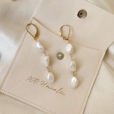 Handcrafted • Waterproof • Tarnish Resistant • Hypoallergenic 3 white Keshi freshwater pearls hand strung on 14k gold filled wire and earring hooks. 14k Gold Filled Pearl White Dangle Pearl Earrings, Everyday Pearl White Pearl Earrings, Adjustable Dangle Pearl Earrings With Pearl Chain, Adjustable Dangle Pearl Chain Earrings, Adjustable Dainty Pearl Earrings, Hypoallergenic Pearl Dangle Earrings, Handmade White Pearl Earrings In 14k Gold Filled, Dainty Pearl White 14k Gold Filled Pearl Earrings, Adjustable Dangle Earrings With Pearl Chain