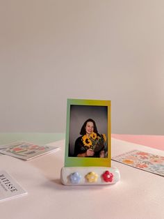 a photo frame sitting on top of a table