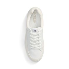 Inspired by tennis shoe designs the Hailey sneaker unites sumptuous leather with soft suede trim. Accented with an “LRL” logo at the tongue for signature style this shoe features an exclusive grooved foam footbed engineered to evenly distribute weight to ensure the utmost comfort with each step. Sporty Sneakers With Embossed Logo And White Sole, Suede Sneakers With White Sole And Embossed Logo, Sporty Leather Platform Sneakers With Embossed Logo, Classic Low-top Golf Shoes With Cushioned Footbed, Classic Low-top Cushioned Golf Shoes, Classic Low-top Slip-on Sneakers With Cushioned Footbed, Classic Low-top Cushioned Slip-on Sneakers, Classic Cushioned Low-top Slip-on Sneakers, Classic Lace-up Tennis Sneakers