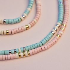 Bring alllllll the beach vibes anywhere you go with our Sealife Necklace. This beaded beauty comes in two sweet shades—a sand-inspired pink and sea-inspired turquoise—plus pops of silver or gold for a mini dose of shine. - Turquoise: brass base with rhodium plating & synthetic howlite beads- Sand: brass base with gold plating & synthetic howlite beads- Chain: 14" with 2" extension. Jump ring at 1" of extension.- Because jewelry products are handcrafted by artisans, dimensions may vary from piece Cheap Oval Beads Necklaces For Beach, Cheap Adjustable Necklaces For Vacation, Cheap Turquoise Beach Jewelry, Cute Cheap Beach Necklaces, Cheap Beaded Necklaces With Gold Beads For Beach, Affordable Beaded Necklace With Dangling Beads For Beach, Cheap Strand Necklaces For The Beach, Surf Necklace Pura Vida, Cheap Beaded Chain Necklaces For Beach