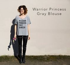 You are a Warrior Princess Poet Dancer.  Inspired by Ephesians 6. We put on the full armor of God, daughters of the King. We are His Warrior Princesses. Wide Neck Blouse, The Full Armor Of God, Full Armor Of God, Gray Blouse, 27 Dresses, Ephesians 6, Vintage Band Tees, Daughters Of The King, Grey Blouse