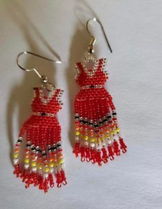 red and yellow beaded earrings on white background