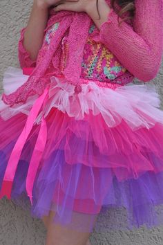 There are multiple reasons to love the tutu skirt! The party skirt has many layers of soft tulle material. There is an elastic waistband that will fit a wide range of sizes. Satin ribbon for an added touch. The best thing about it is that it is handmade in Bali and sent over with LOVE! Great to wear to a birthday party, dance recital, or just because. Get the perfect skirt your little one will love today. Made from soft tulle Multi-layer skirt Elastic waistband Spot clean only. Steam to soften t Birthday Party Dance, Skirt With Ribbon, Handmade Tutu, Girl Tutu Skirt, Tulle Material, Dance Recital, Party Dance, Tulle Tutu, Soft Tulle